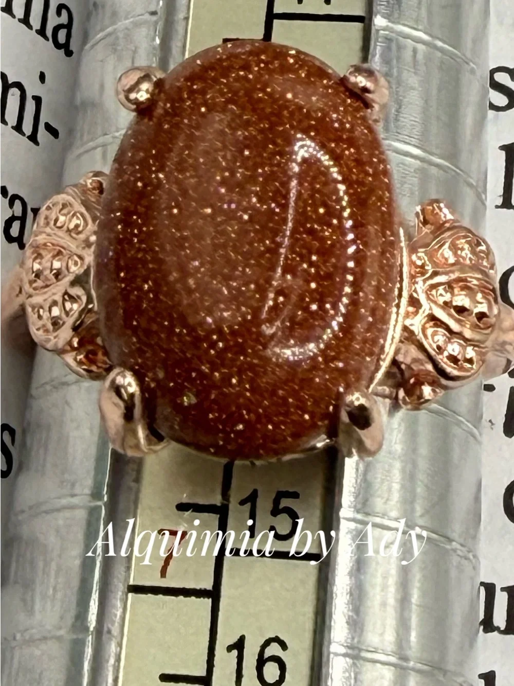 Rose Gold-Tone Ring with Sparkling Brown Goldstone Oval